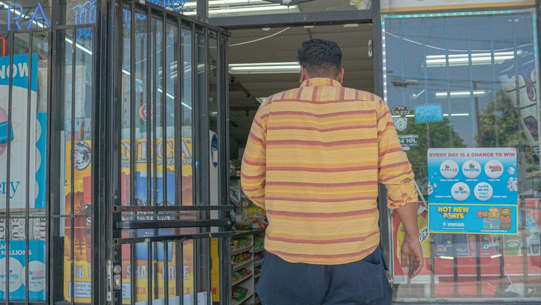 store detective watching shoplifter