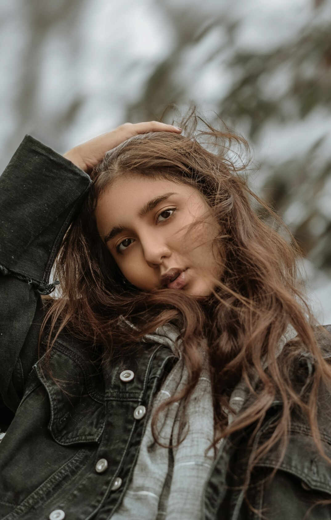 Portrait of a smiling young woman with long hair