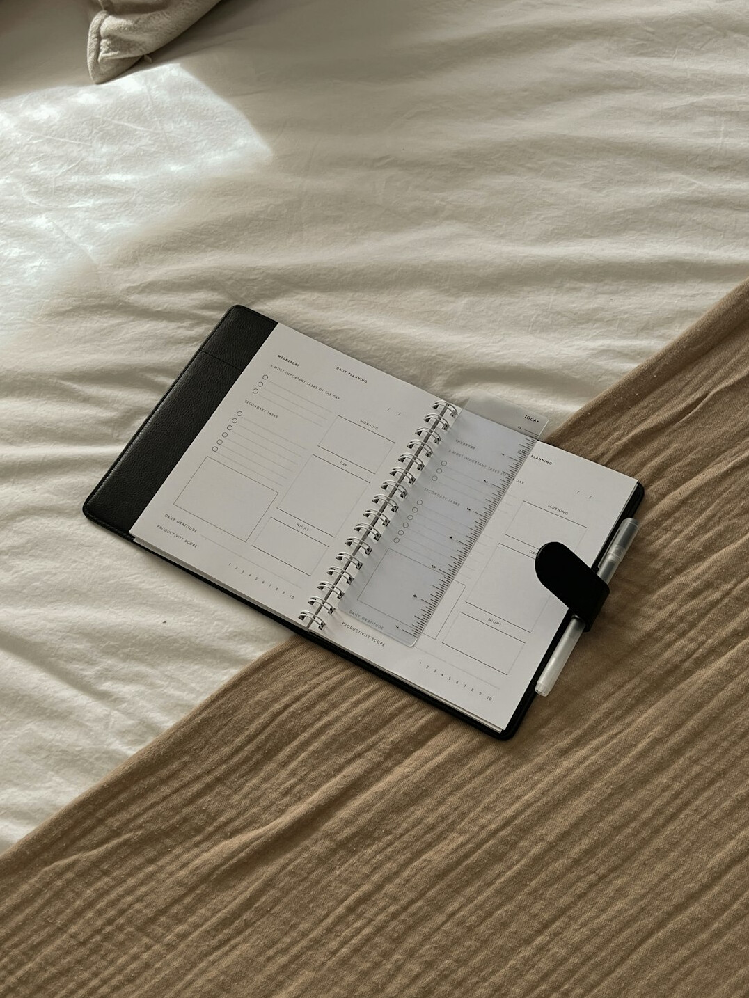 Open notebook with a pen on a desk